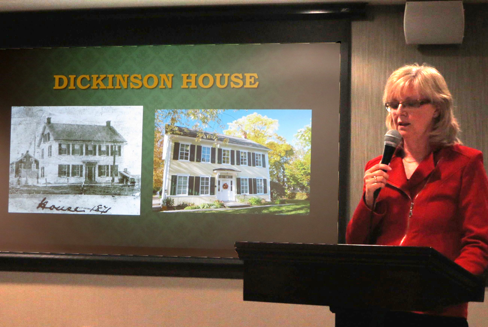 Maureen McPhee showing a slide of the Dickinson House then and  now.