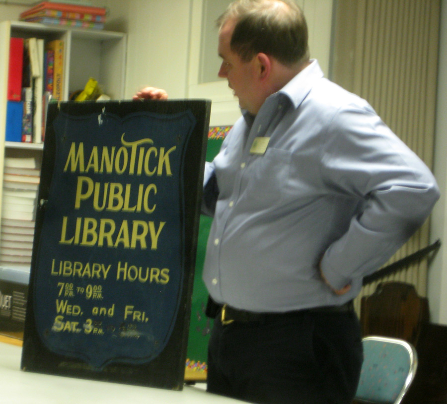 Greg Hutton with Manotick Library Sign