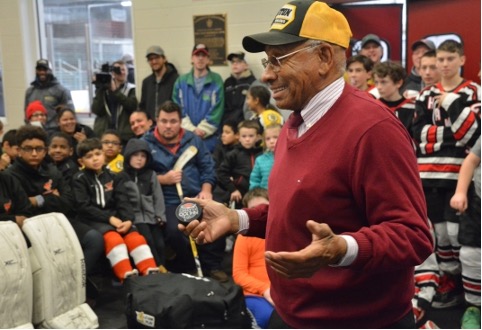 Willie O'Ree engaging with youth in the NHL's "Hockey is for Everyone" program