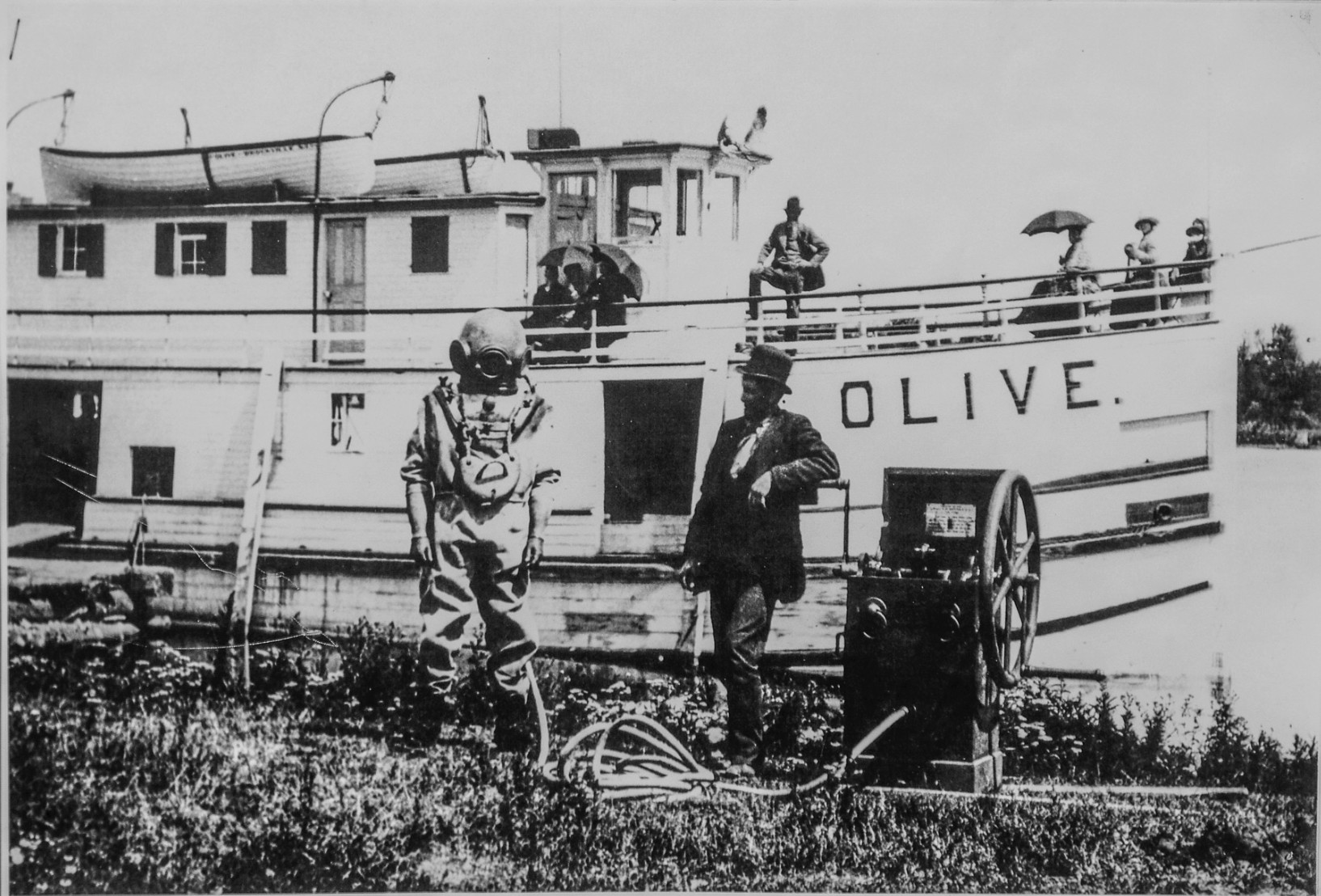 The Olive at Lindsay's Wharf - c.1890s. Charles Lindsay, wharfinger, in the top hat, Jim Scott, diver, Adam Foster, Captain.